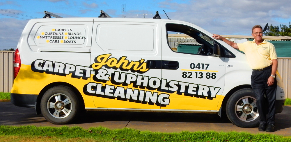 John from John's Carpet and Upholstery Cleaning and his van.